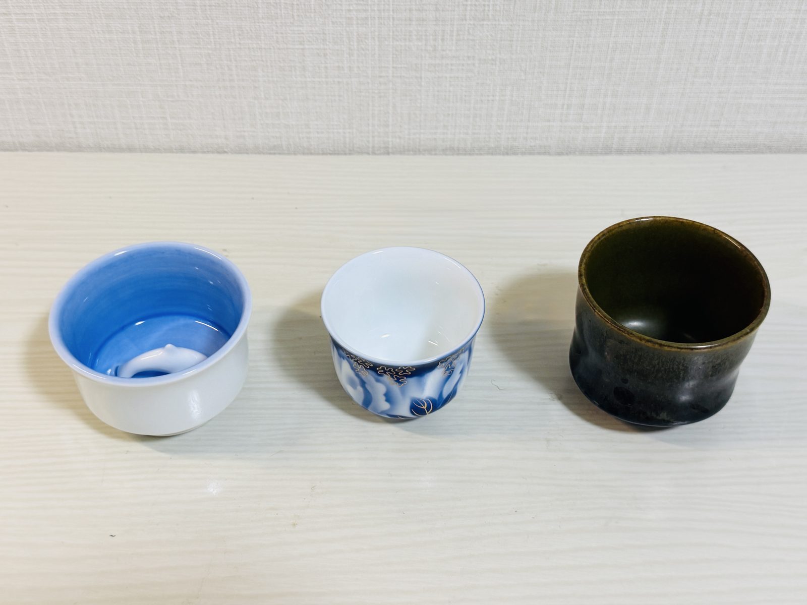 Takahama Ware, Fukagawa Seiji, and Satsuma ware guinomi side by side